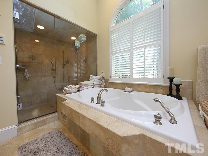 600 Marlowe Road Raleigh, NC 27609 - Photo 12 of 18 a spacious bathroom with a tub a sink and shower