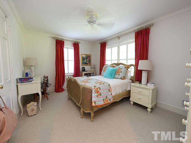 600 Marlowe Road Raleigh, NC 27609 - Photo 14 of 18 a bedroom with a bed and a couch