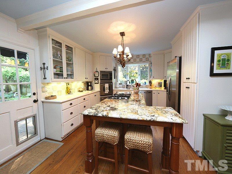 600 Marlowe Road Raleigh, NC 27609 - Photo 6 of 18 a dining table chair and a chandelier