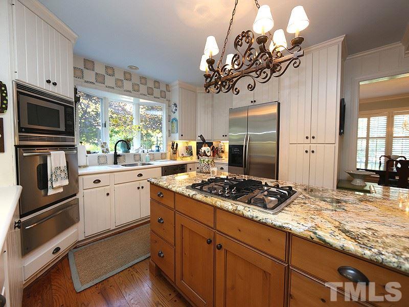 600 Marlowe Road Raleigh, NC 27609 - Photo 7 of 18 a kitchen with stainless steel appliances granite countertop a stove refrigerator and microwave