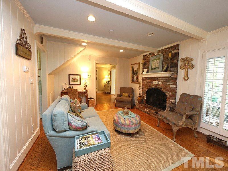 600 Marlowe Road Raleigh, NC 27609 - Photo 8 of 18 a living room with furniture and a fireplace