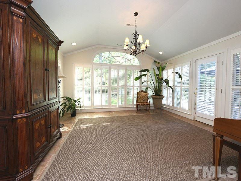 600 Marlowe Road Raleigh, NC 27609 - Photo 9 of 18 a view of a livingroom with a chandelier wooden floor and windows