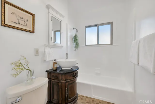 a backyard of a house with potted plants