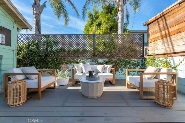 a backyard of a house with outdoor seating