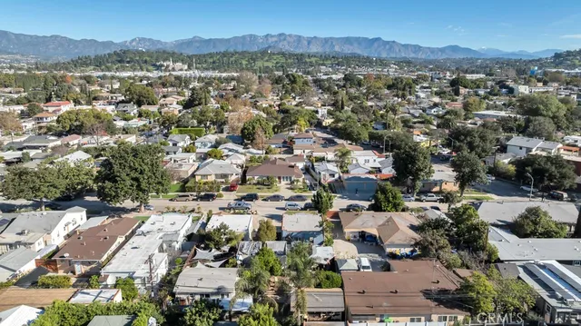 an aerial view of residential house and green space
