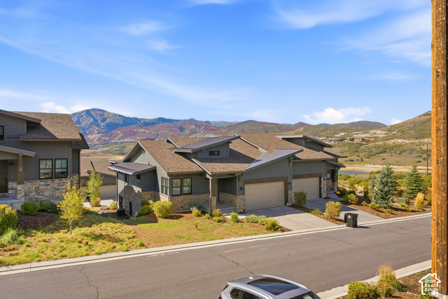 369 East Overlook Loop Kamas, UT 84036 - Photo 55 of 64 Modern architectural design with stone and siding exterior, multi-pitched rooflines, two-car garage, and established landscaping