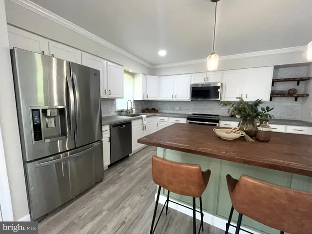 a view of a livingroom with a flat screen tv