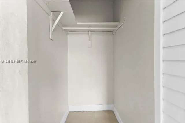 a bathroom with a sink a mirror and a shower