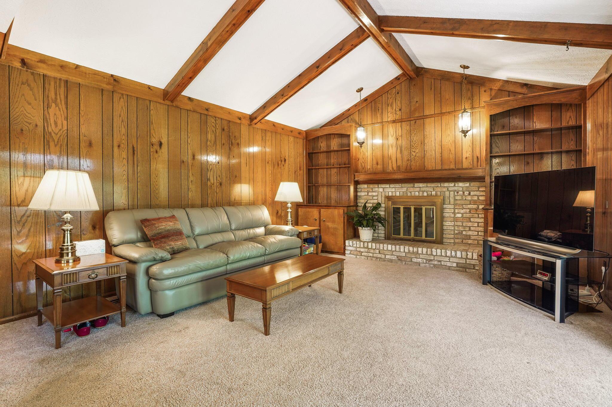 1180 Chatham Ridge Road Westerville, OH 43081 - Photo 37 of 69 Large family room with fireplace with beamed vaulted ceilings