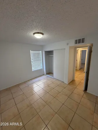 a view of an empty room and a window