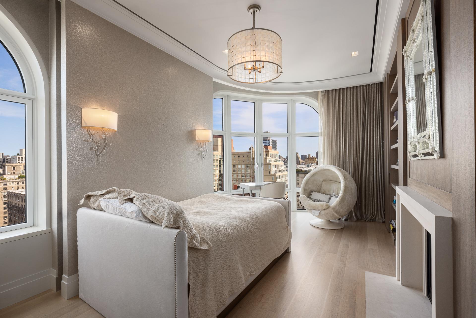 535 West End Avenue, Unit PH Manhattan, NY 10024 - Photo 17 of 19 a bed room with a bed and a chandelier