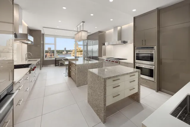 a dining room with furniture a chandelier and wooden floor