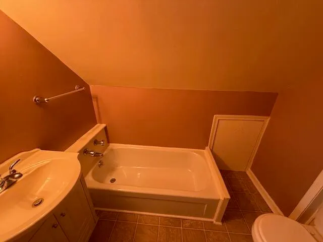 a bathroom with a sink and toilet