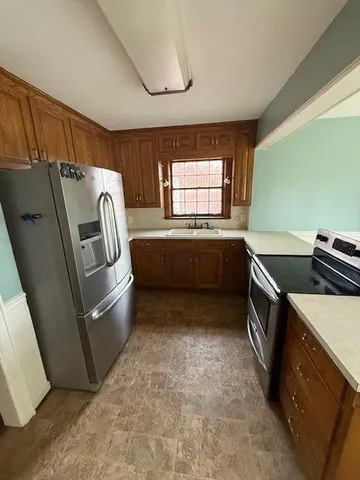 a view of a kitchen with a sink and dishwasher