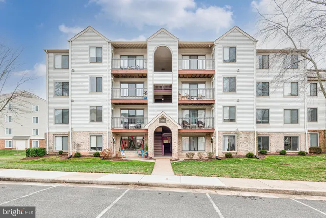 a view of a brick building next to a yard