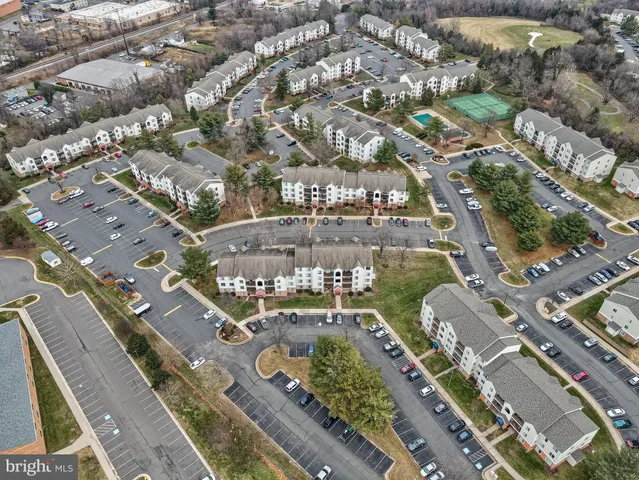 an aerial view of a house with a swimming pool