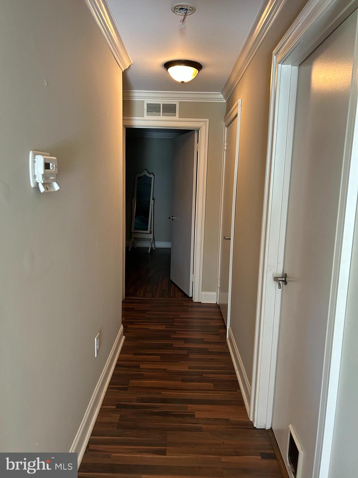907 A Oliphant Lane Mount Laurel, NJ 08054 - Photo 12 of 23 a view of a hallway with wooden floor and staircase