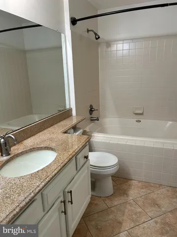 a bathroom with a shower and a toilet