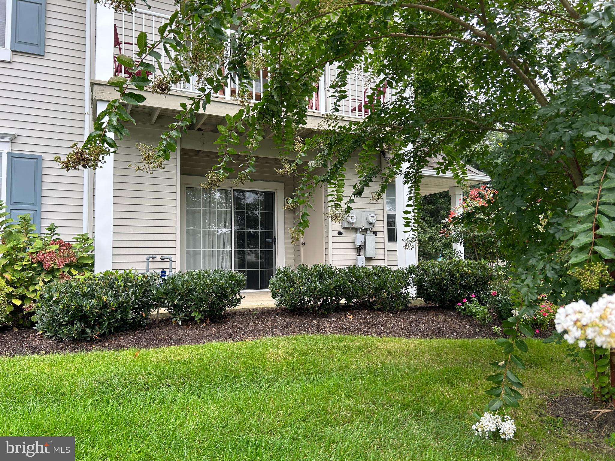 907 A Oliphant Lane Mount Laurel, NJ 08054 - Photo 2 of 23 a view of a house with a yard and plants