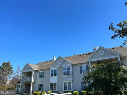 a view of a swimming pool and trees in the background