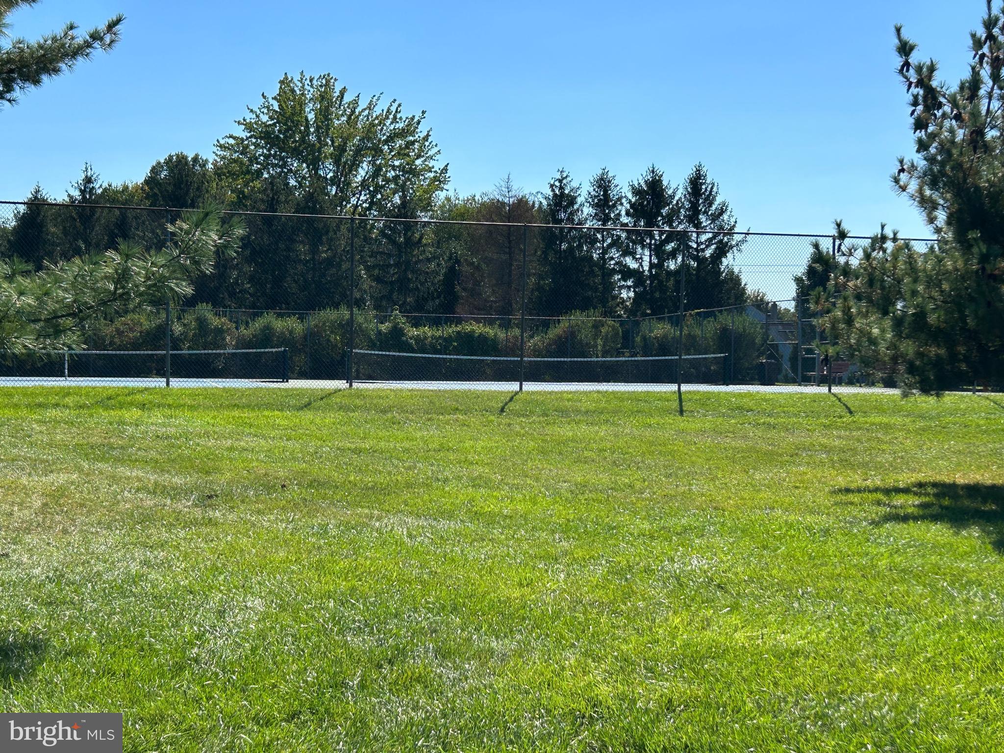 907 A Oliphant Lane Mount Laurel, NJ 08054 - Photo 23 of 23 a view of a swimming pool and trees in the background