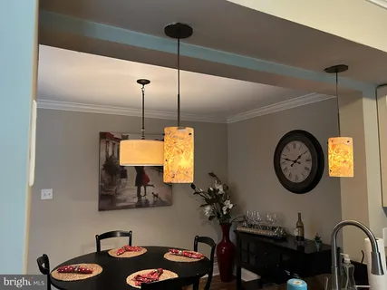 a kitchen with stainless steel appliances granite countertop a sink a stove and cabinets