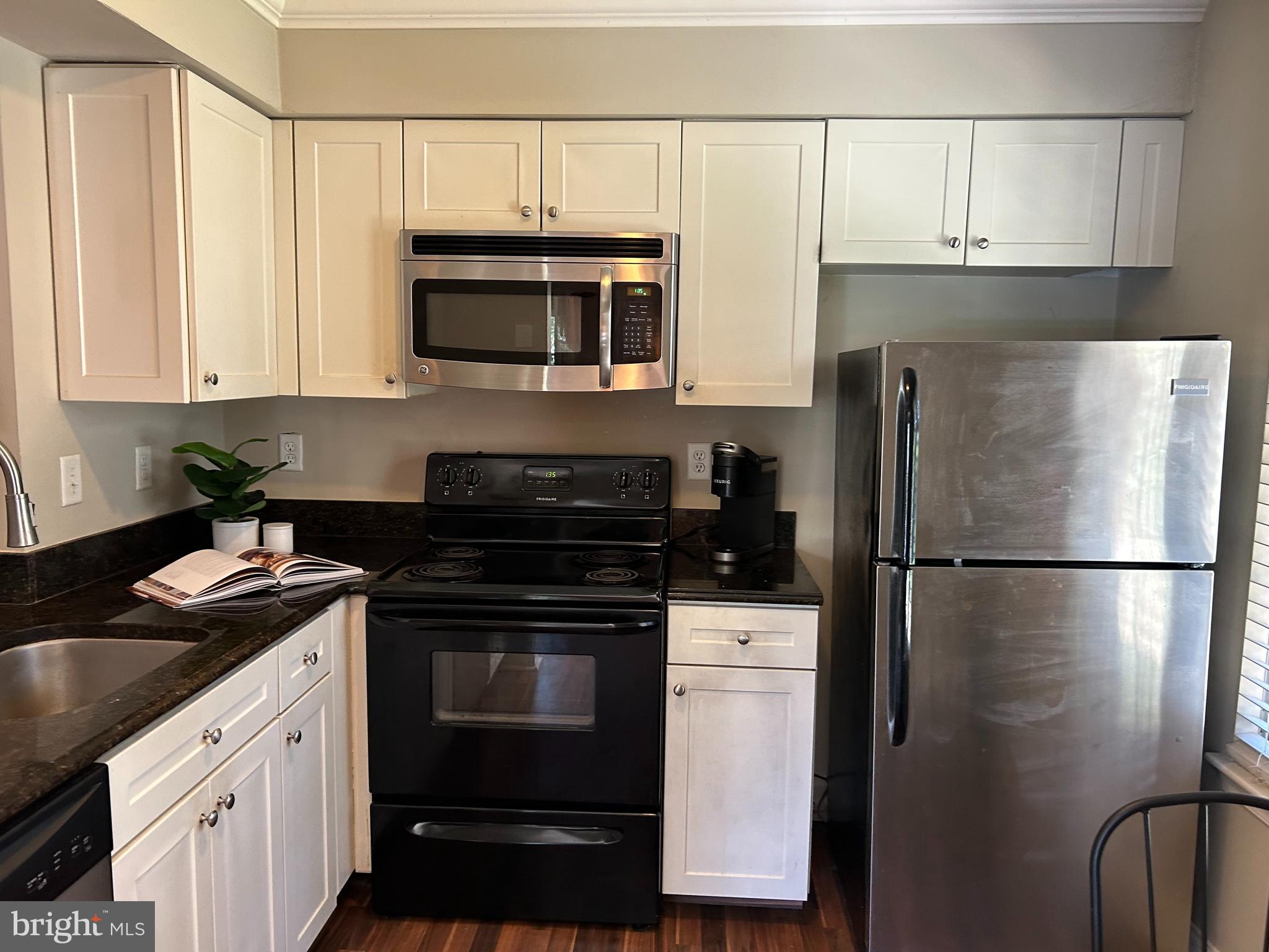 907 A Oliphant Lane Mount Laurel, NJ 08054 - Photo 10 of 23 a kitchen with a refrigerator stove and microwave