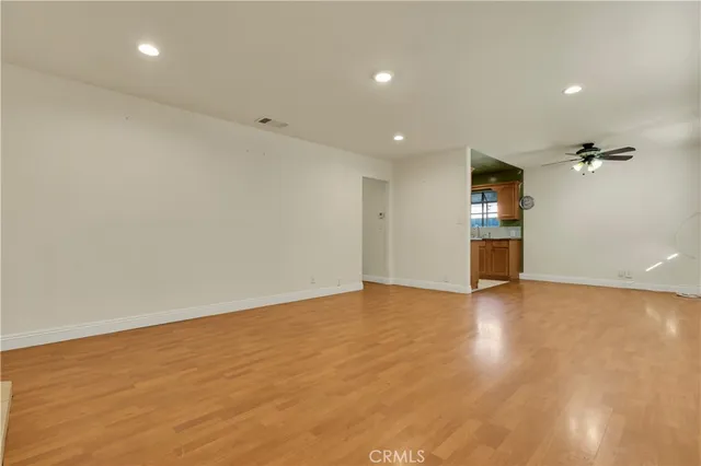 an empty room with a empty space and windows