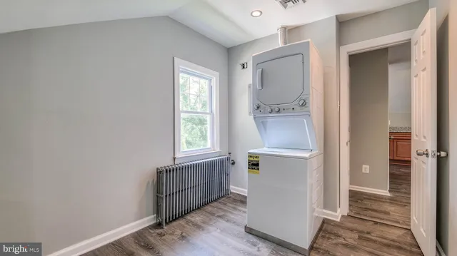 a room with a window and wooden floor