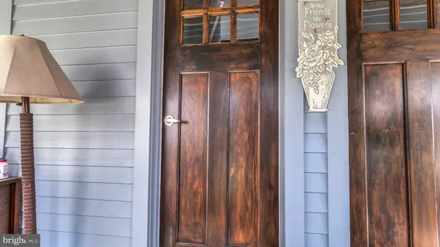 a bathroom with a glass door shower and a sink