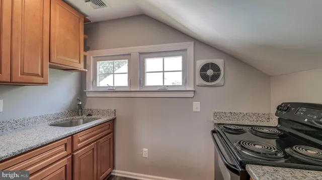 a kitchen with a stove and a sink