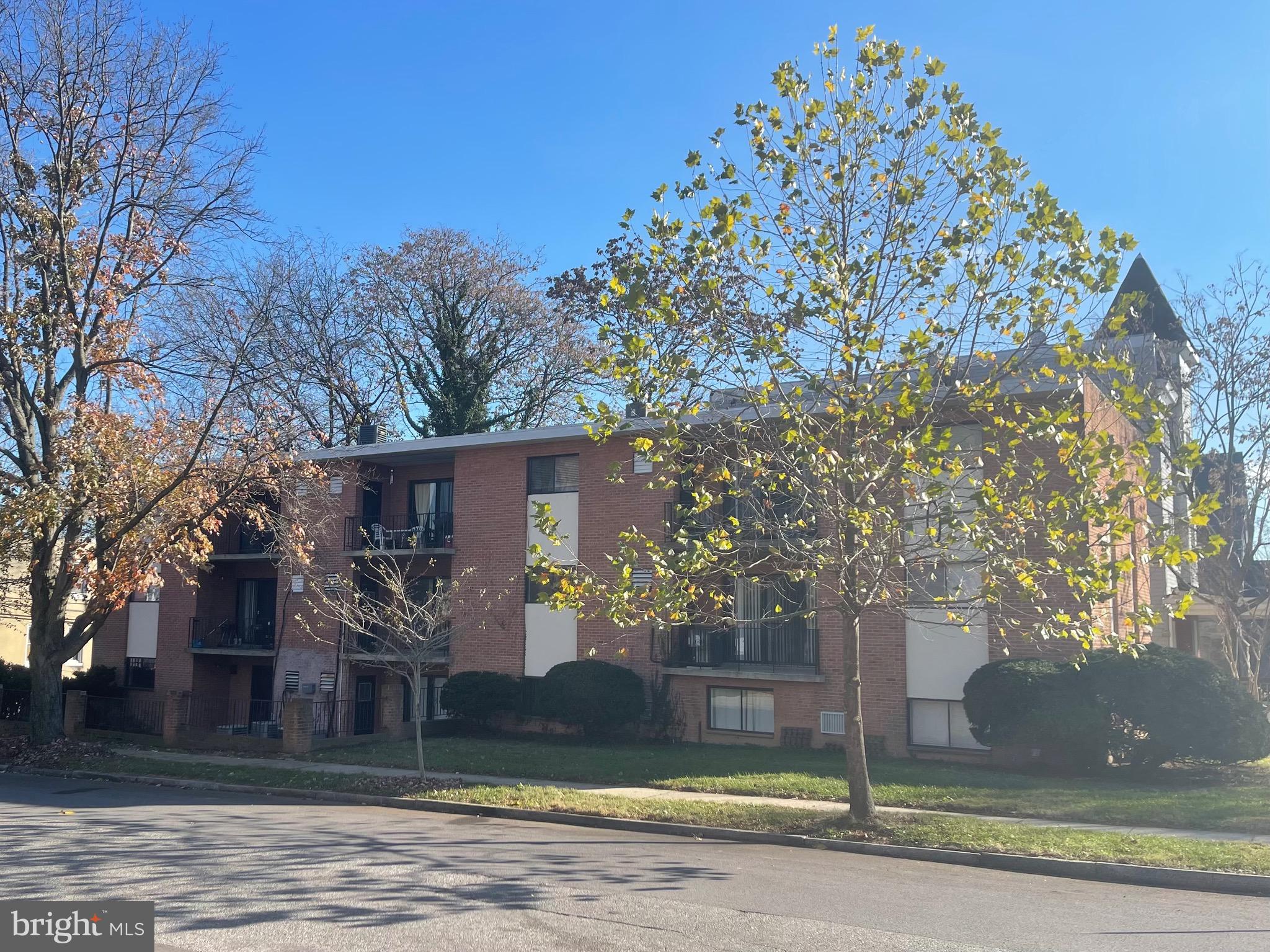 201 South Augusta Avenue, Unit A5 Baltimore, MD 21229 - Photo 1 of 12 a front view of a house with a yard