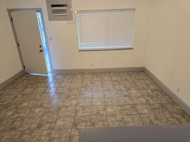 a view of an empty room with a window