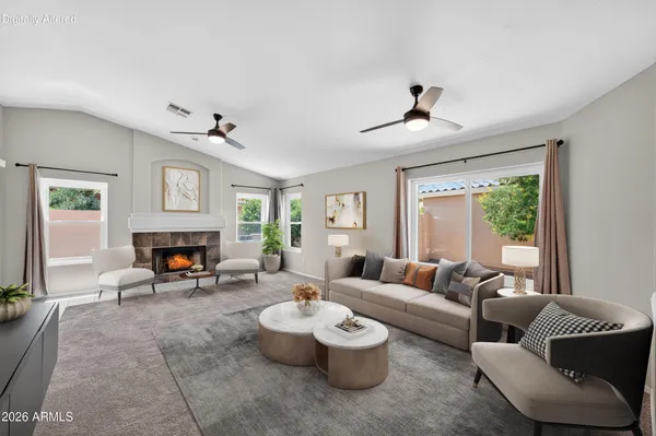 a living room with furniture and a fireplace
