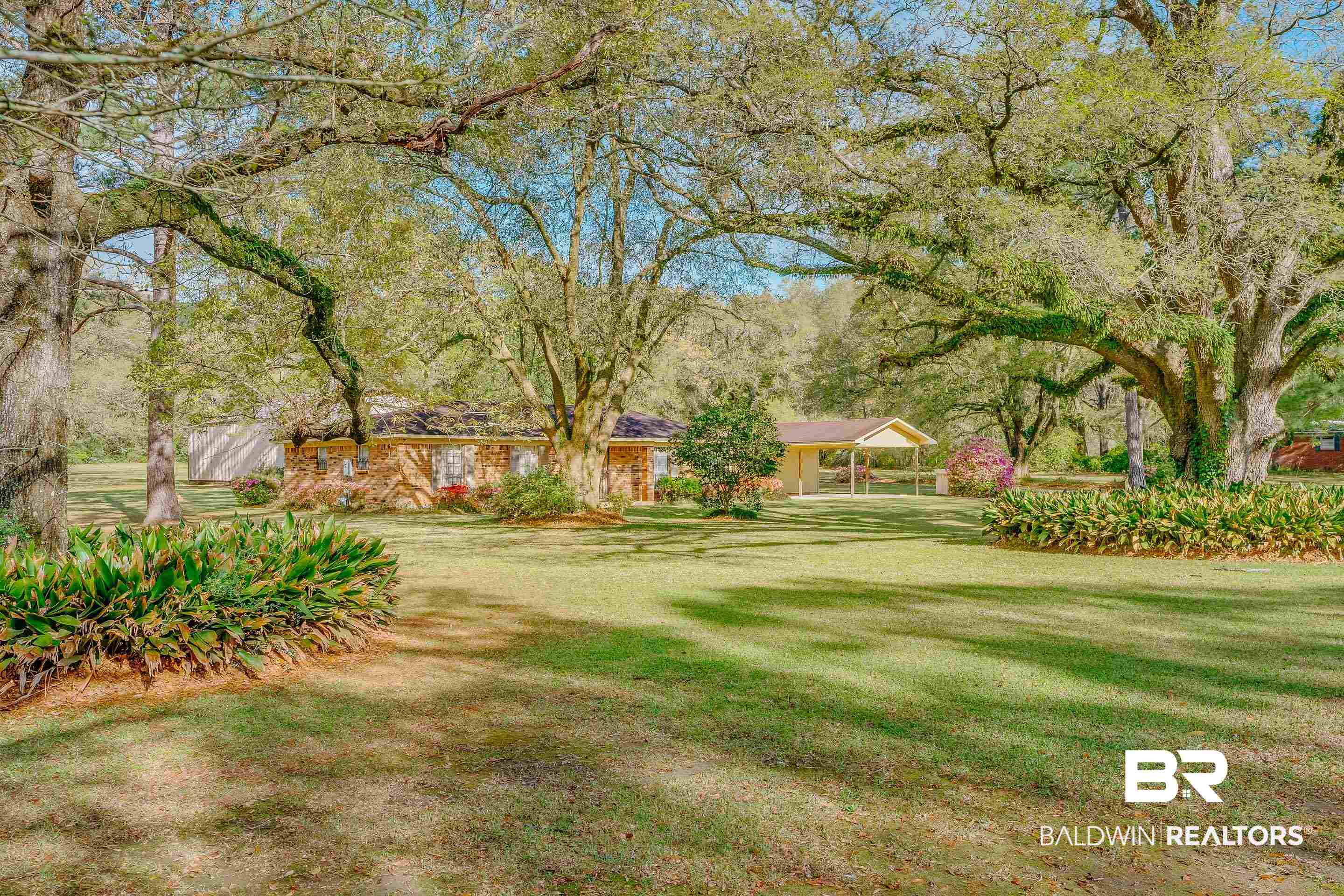 5151 McCrary Road Semmes, AL 36575 - Photo 15 of 62 View of green lawn with a detached carport