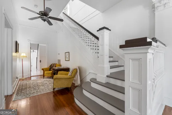 a view of a hallway view with a chandelier
