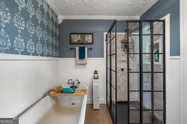 a bedroom with a bed and a fireplace