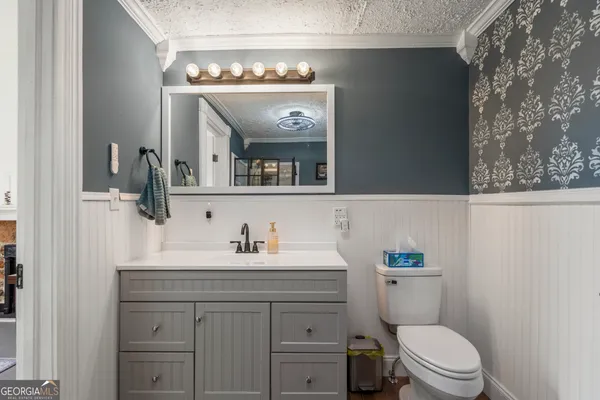 a spacious bedroom with a bed and a fireplace