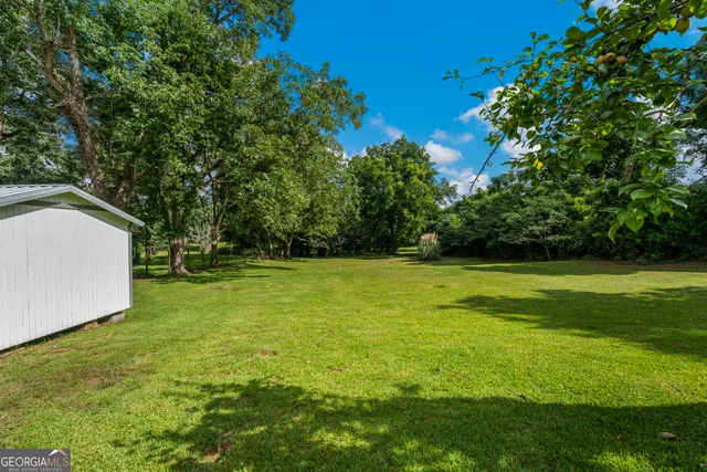 a view of a chairs and tables in the yard
