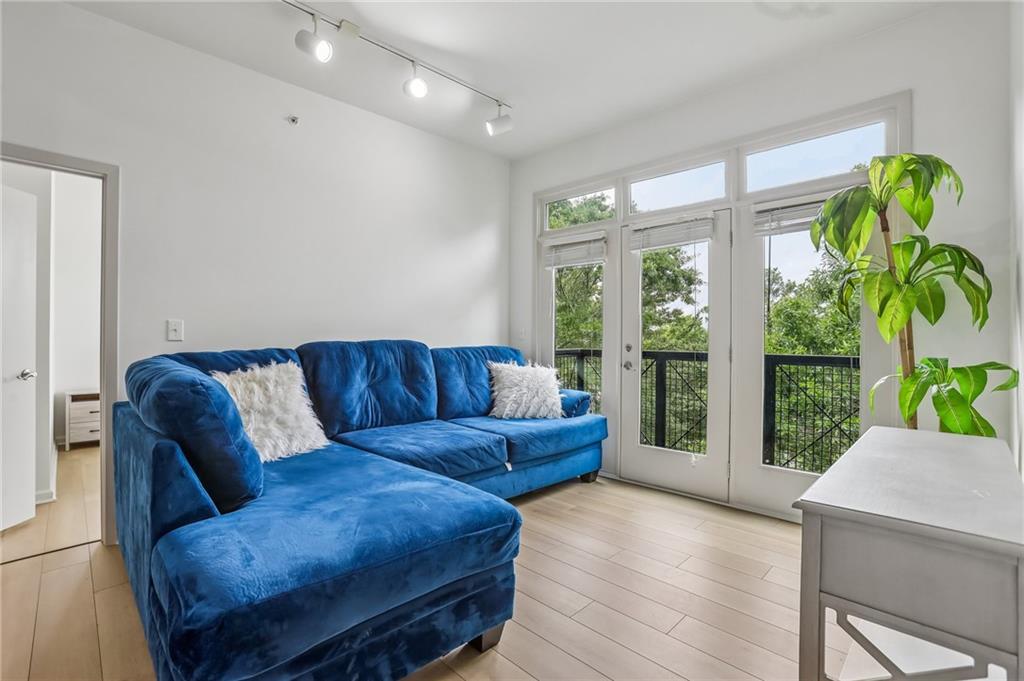 5300 Peachtree Road, Unit 3506 Atlanta, GA 30341 - Photo 4 of 25 a living room with furniture and a large window