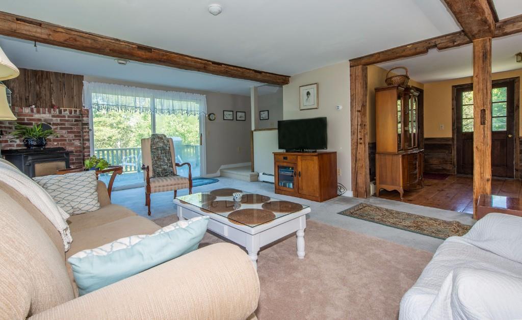 581 Ocean Point Road Boothbay, ME 04544 - Photo 16 of 25 Living room with rear stairs and...