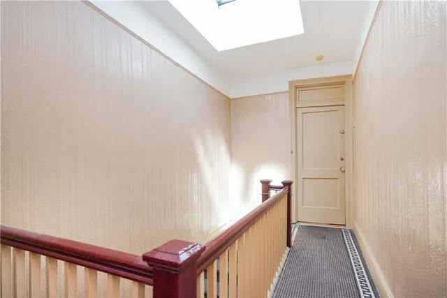 a view of a hallway with stairs