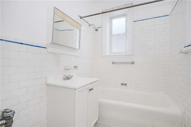 a bathroom with a sink a bathtub and a shower