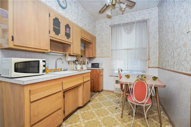 a kitchen with stainless steel appliances granite countertop a sink and cabinets