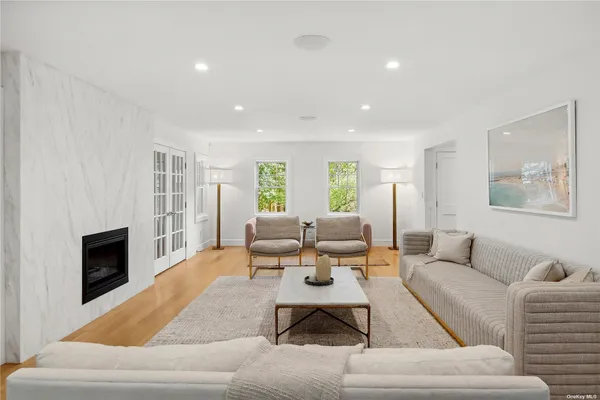 a living room with furniture or couch and a fireplace