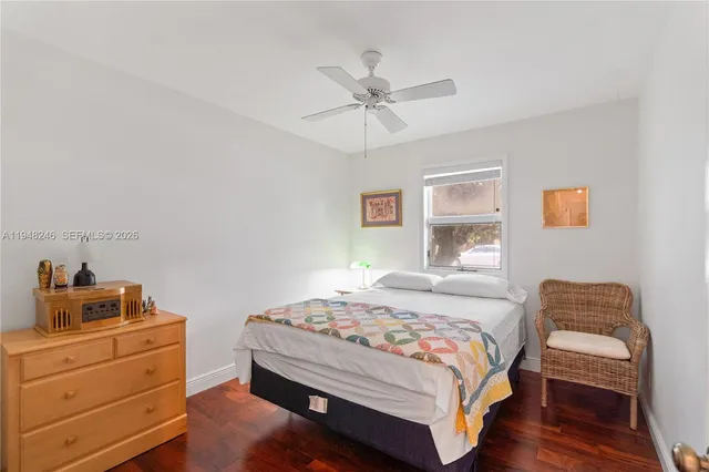 a bedroom with a bed and a table