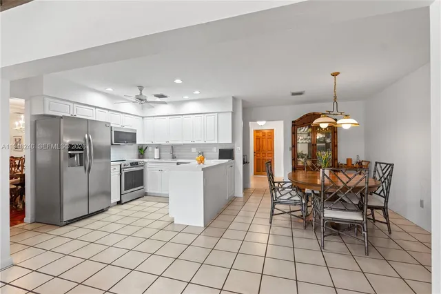 a view of a dining room with furniture window and outside view