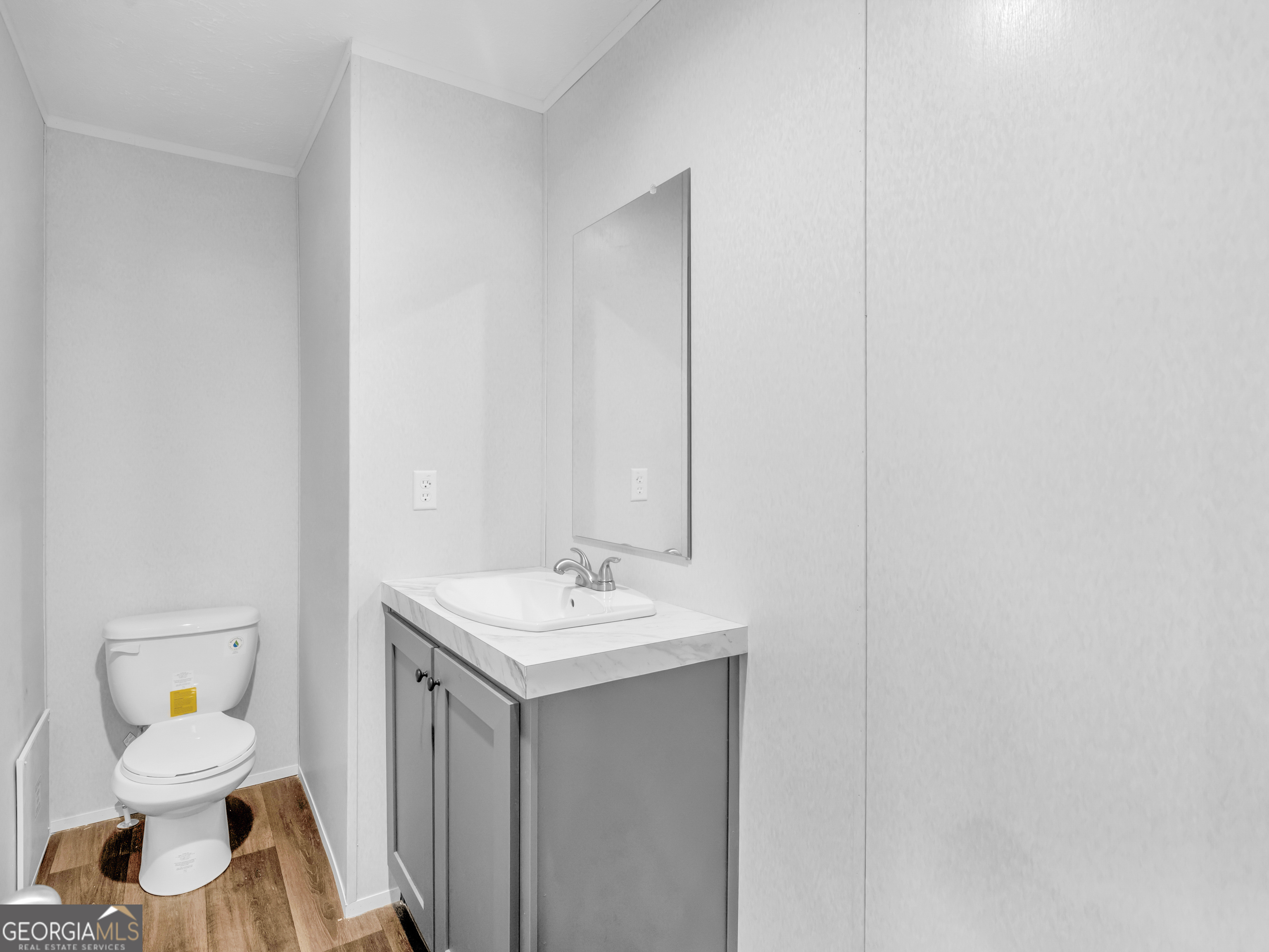 115 Gregory Lane Eatonton, GA 31024 - Photo 17 of 62 a bathroom with a sink a toilet and a mirror