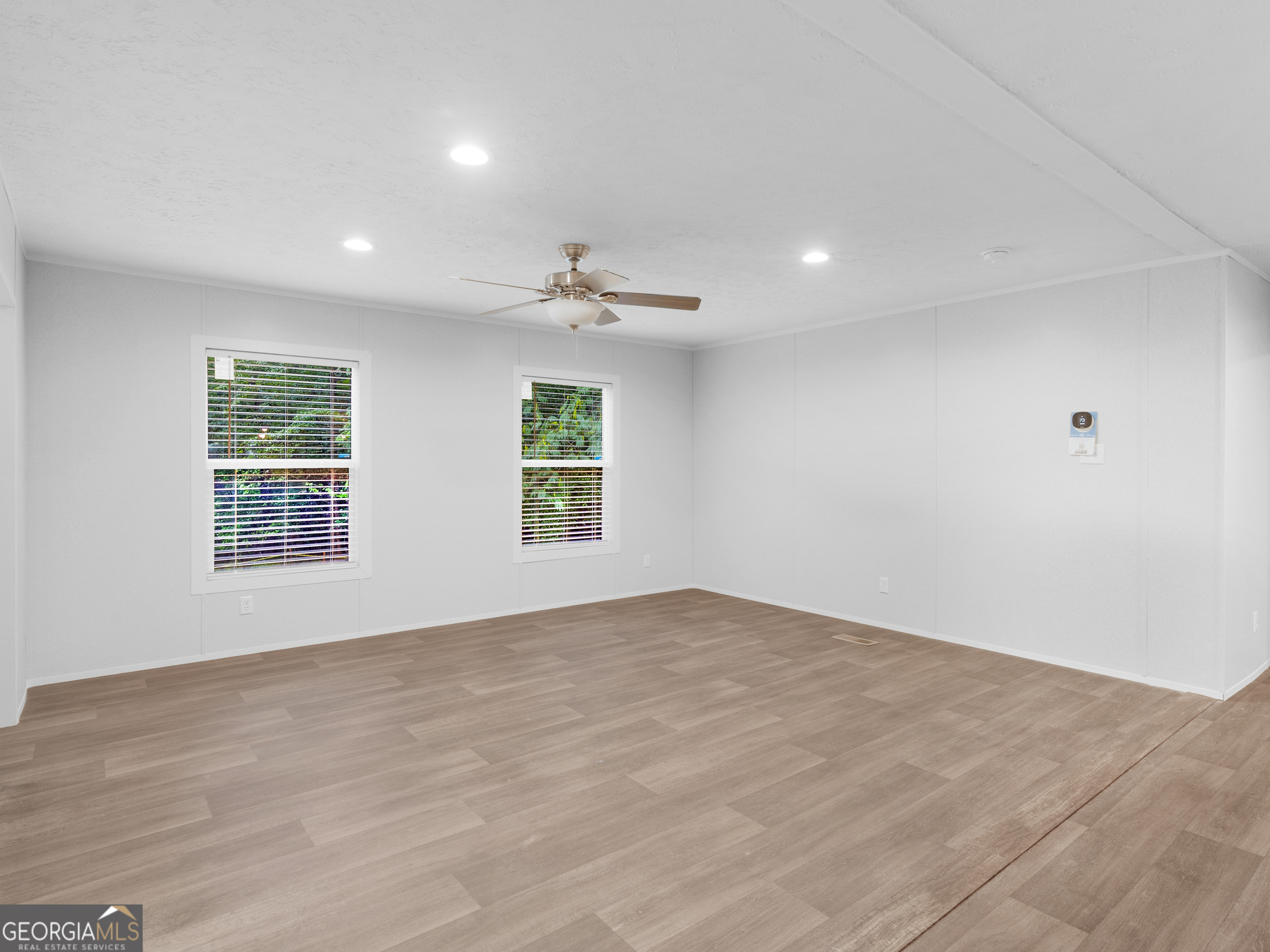 115 Gregory Lane Eatonton, GA 31024 - Photo 18 of 62 a view of an empty room with a window