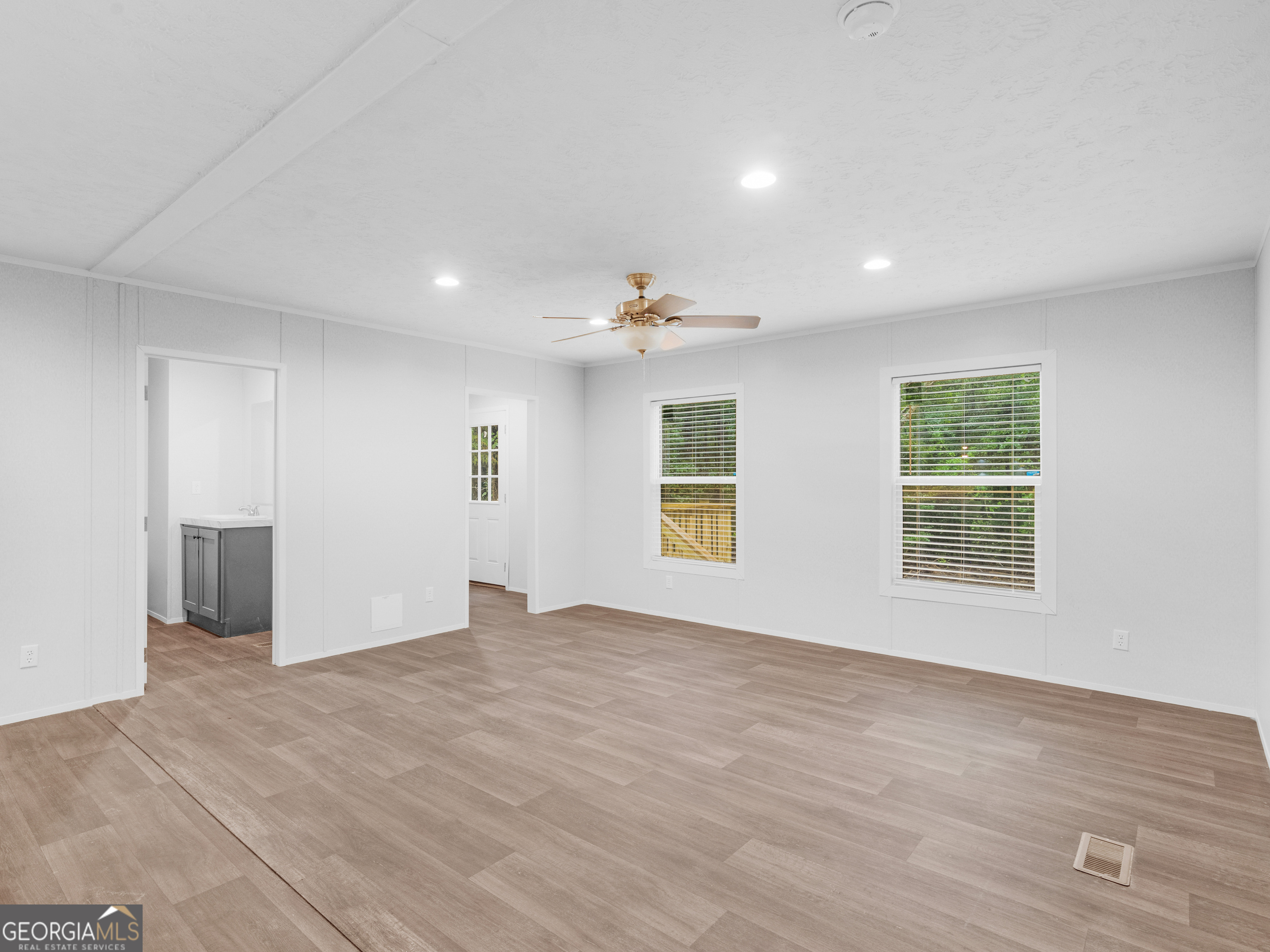 115 Gregory Lane Eatonton, GA 31024 - Photo 19 of 62 a view of an empty room with a window